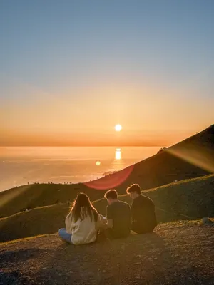 Friends watching sunset at Trojan Point